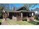 Charming brick home with a covered front porch and well-manicured lawn at 146 Saluda St, Chester, SC 29706