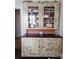 Kitchen china cabinet, with a collection of glassware and dishware, adds charm to this space at 146 Saluda St, Chester, SC 29706