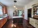 Bright kitchen with stainless steel appliances, kitchen island, and abundant natural light, and hardwood flooring at 146 Saluda St, Chester, SC 29706