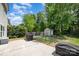 Outdoor space with a well-maintained lawn, patio, grill, storage shed, and private backyard area at 15619 Lakepoint Forest Dr, Charlotte, NC 28278