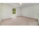 Carpeted bedroom featuring a single window providing natural light at 15619 Lakepoint Forest Dr, Charlotte, NC 28278