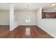 Dining room with hardwood floors, chandelier and bright light at 15619 Lakepoint Forest Dr, Charlotte, NC 28278