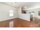 Dining room with hardwood floors, chandelier and access to the kitchen at 15619 Lakepoint Forest Dr, Charlotte, NC 28278
