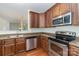 Gourmet kitchen features stainless appliances and granite countertops at 15619 Lakepoint Forest Dr, Charlotte, NC 28278