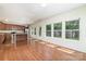 Spacious living room featuring a modern kitchen, hardwood floors and plenty of natural light at 15619 Lakepoint Forest Dr, Charlotte, NC 28278
