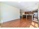 Open floor plan featuring hardwood floors with views of the modern kitchen and eat-in area at 15619 Lakepoint Forest Dr, Charlotte, NC 28278