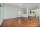 Open concept living room with hardwood floors, bright and airy space at 15619 Lakepoint Forest Dr, Charlotte, NC 28278