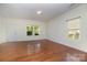 Bright and airy living room with hardwood floors and ample natural light at 15619 Lakepoint Forest Dr, Charlotte, NC 28278