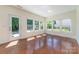 Bright living area featuring hardwood floors, a glass door, and plenty of natural light at 15619 Lakepoint Forest Dr, Charlotte, NC 28278