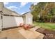Private patio area with outdoor seating adjacent to a storage shed and green space at 1720 Chamberside Dr, Rock Hill, SC 29730