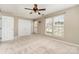 Bedroom featuring a ceiling fan, closet and multiple windows bringing in natural light at 1720 Chamberside Dr, Rock Hill, SC 29730