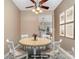 Cozy dining area with a round table, four chairs, and art-adorned walls, creating a warm atmosphere at 1720 Chamberside Dr, Rock Hill, SC 29730