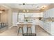 Bright kitchen boasts white cabinetry, a center island with bar seating, and stainless steel appliances at 1720 Chamberside Dr, Rock Hill, SC 29730
