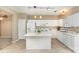 Charming kitchen features an island, white cabinets, and modern appliances at 1720 Chamberside Dr, Rock Hill, SC 29730