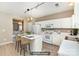 Bright kitchen featuring white cabinets, a center island with seating and updated appliances at 1720 Chamberside Dr, Rock Hill, SC 29730