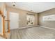 Open concept living room features light-colored floors, large window for natural light, and a fresh coat of paint at 1720 Chamberside Dr, Rock Hill, SC 29730