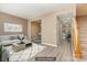 Bright and spacious living room with hardwood floors, neutral walls, and staircase access at 1720 Chamberside Dr, Rock Hill, SC 29730