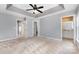 Spacious main bedroom with tray ceiling, ceiling fan and ensuite bathroom access at 1720 Chamberside Dr, Rock Hill, SC 29730