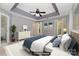 Spacious main bedroom features a tray ceiling, a ceiling fan, and neutral tones for a serene ambiance at 1720 Chamberside Dr, Rock Hill, SC 29730
