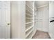 Walk-in closet offering ample storage with built-in shelving and hanging rods, perfect for organization at 1720 Chamberside Dr, Rock Hill, SC 29730