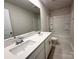 Bathroom featuring double vanity, white countertops, and shower-tub combo with tile floors at 1986 Paddlewheel Dr, Stanley, NC 28164