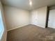 A bright bedroom with neutral walls, plush carpet, and ample natural light, perfect for creating a relaxing retreat at 1986 Paddlewheel Dr, Stanley, NC 28164