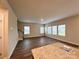 Bright and spacious living room area with large windows and elegant flooring, creating a welcoming atmosphere at 1986 Paddlewheel Dr, Stanley, NC 28164