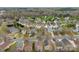 An aerial view of a neighborhood showcases many houses and a dense tree line at 2011 Dunsmore Ln # 137, Waxhaw, NC 28173