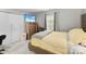 This bedroom offers a bed, flatscreen TV, closet, and window to filter natural light into the room at 2011 Dunsmore Ln # 137, Waxhaw, NC 28173