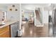Spacious living area with hardwood floors, adjacent to the staircase and modern kitchen at 2011 Dunsmore Ln # 137, Waxhaw, NC 28173