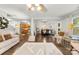 Spacious living room featuring hardwood floors that flow to the kitchen and dining areas at 2011 Dunsmore Ln # 137, Waxhaw, NC 28173