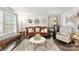Comfortable living room featuring a plush rug, stylish seating, and natural light from large windows at 2011 Dunsmore Ln # 137, Waxhaw, NC 28173