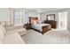 The primary bedroom has a king bed, an ensuite bathroom, and large windows at 2011 Dunsmore Ln # 137, Waxhaw, NC 28173