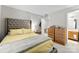 This main bedroom features a bed, and a double dresser in the same room as the main bathroom at 2011 Dunsmore Ln # 137, Waxhaw, NC 28173