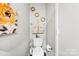 Tastefully decorated powder room features charming gold accents, adding a touch of elegance at 2011 Dunsmore Ln # 137, Waxhaw, NC 28173