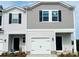 Charming townhome featuring neutral siding, a one-car garage, and a welcoming front entrance at 2020 Old Rivers Rd, Concord, NC 28027