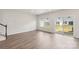 Bright, open living room with wood floors and sliding door to the backyard at 2070 Old Rivers Rd, Concord, NC 28027
