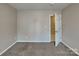 This bedroom features neutral paint, carpet flooring and a closet at 2122 Shumard Cir, Indian Trail, NC 28079