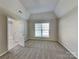 Cozy bedroom with plush carpet, ample natural light, and neutral color scheme at 2122 Shumard Cir, Indian Trail, NC 28079