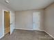 This bedroom features a closet, neutral paint and carpet flooring at 2122 Shumard Cir, Indian Trail, NC 28079