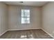 This bedroom features carpet flooring, a window and neutral paint at 2122 Shumard Cir, Indian Trail, NC 28079
