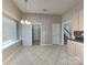 Bright dining area with chandelier lighting and tile floors at 2122 Shumard Cir, Indian Trail, NC 28079