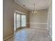 Formal dining room featuring a bay window and classic chandelier at 2122 Shumard Cir, Indian Trail, NC 28079