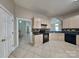 Clean kitchen featuring tile floors, modern appliances, and ample storage at 2122 Shumard Cir, Indian Trail, NC 28079