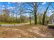 The back yard is spacious and has a great view from the partially covered back porch at 216 E Georgia Ave, Bessemer City, NC 28016