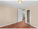 Bright bedroom featuring neutral paint, a ceiling light, and hardwood floors at 216 E Georgia Ave, Bessemer City, NC 28016