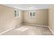 Cozy bedroom with two windows providing plenty of natural light and new flooring at 216 E Georgia Ave, Bessemer City, NC 28016