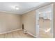 Cozy bedroom leading to kitchen, featuring new flooring at 216 E Georgia Ave, Bessemer City, NC 28016
