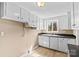 Well-lit kitchen with ample cabinet space and a window overlooking the surrounding landscape at 216 E Georgia Ave, Bessemer City, NC 28016
