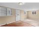 Bright living room showcasing a mix of hardwood and laminate flooring at 216 E Georgia Ave, Bessemer City, NC 28016
